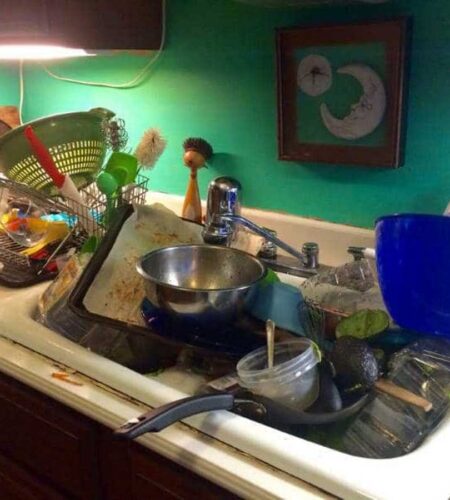 a sink full of dirty dishes